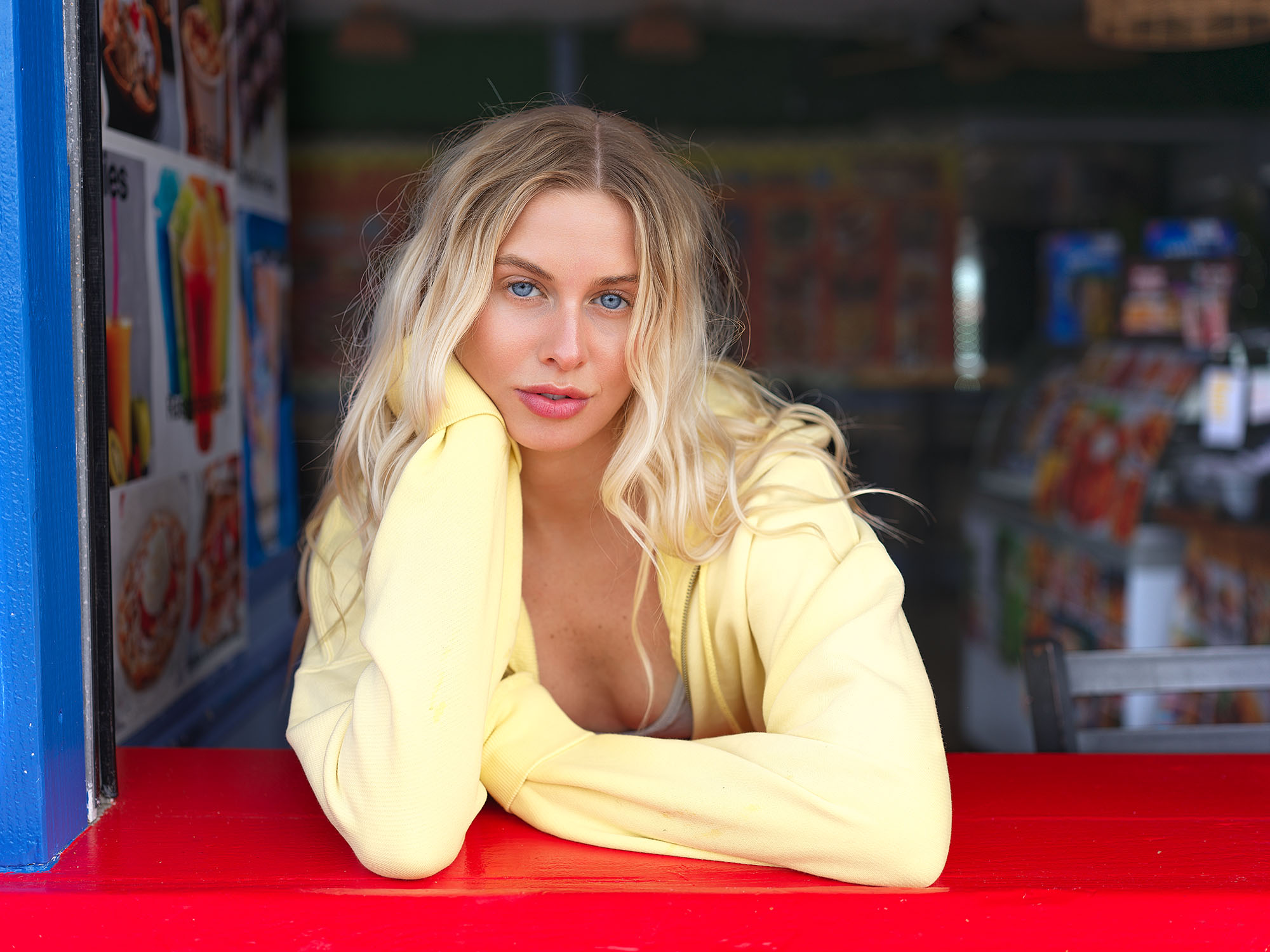 Lifestyle fashion portrait of model at colorful beach food stand window — Jason Guffy Photography